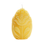 Sculpted beeswax egg shaped pillar candle with allover floral design.