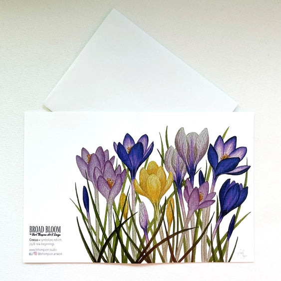 Watercolor crocus flower notecard with purple and yellow blooms.