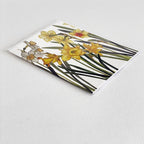 Bulb & Blossom Daffodil Notecard featuring a watercolor design of yellow and white spring daffodils with bright orange centers.