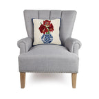 A woolen needle hook pillow featuring amaryllis flowers in a chinoiserie vase.