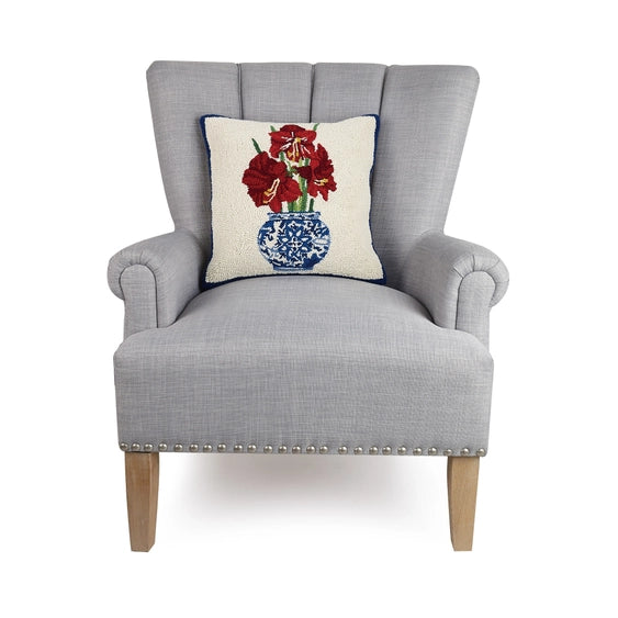 A woolen needle hook pillow featuring amaryllis flowers in a chinoiserie vase.