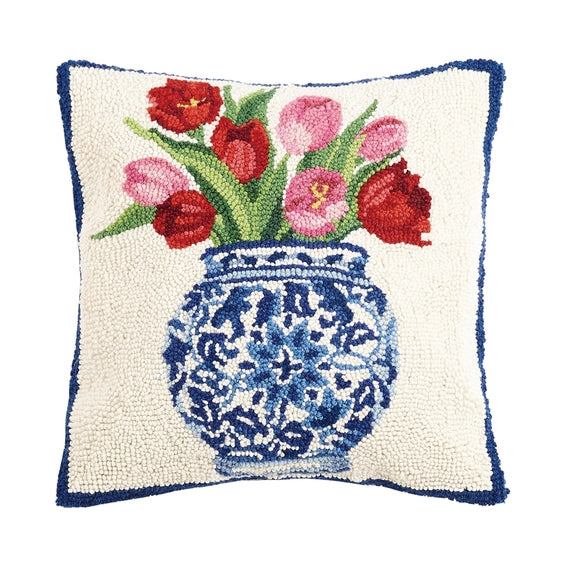 A woolen needle hook throw pillow featuring a chinoiserie vase filled with red and pink tulips.