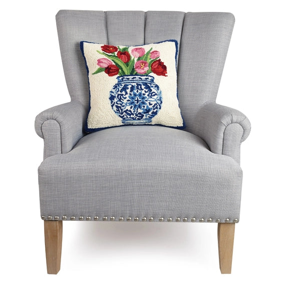 A woolen needle hook pillow featuring tulips in a chinoiserie vase.