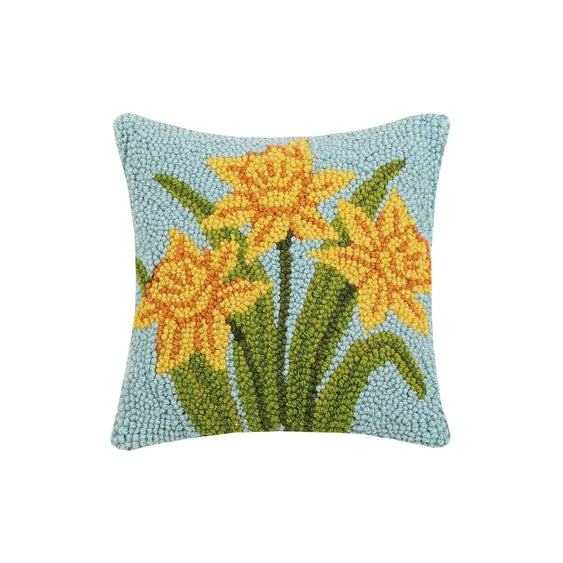 A woolen needle hook decorative pillow featuring three daffodil blooms