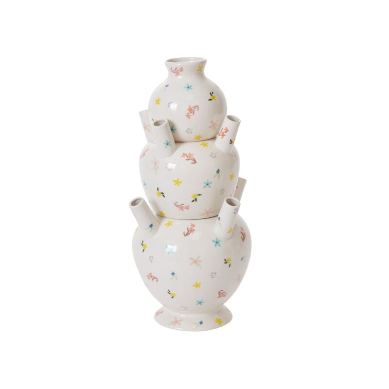 The Ditsy Floral Tulipiere Vase is a three-tiered white ceramic vase with multiple spouts, featuring colorful flower and fish patterns, displayed on a plain white background.
