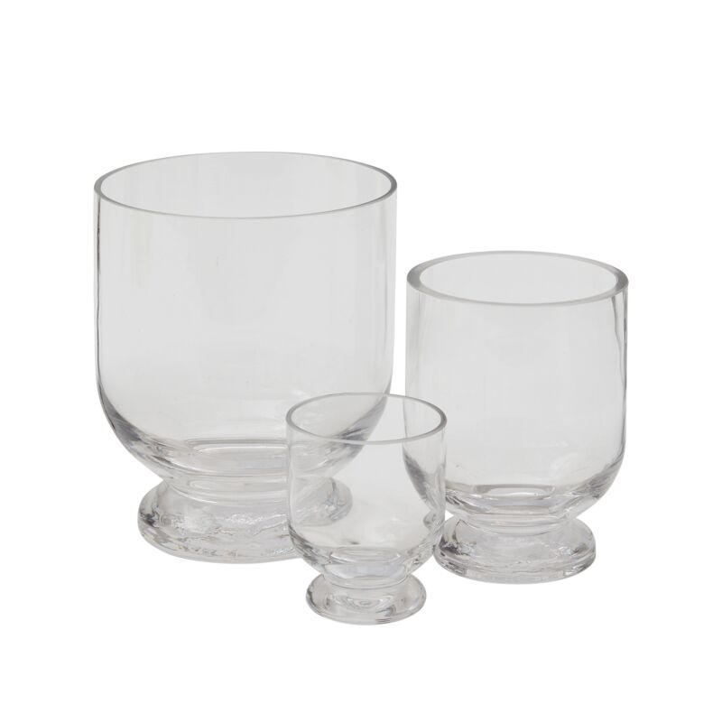 The sturdy Hollis Forcing Vase is clear glass with a pedestal foot and comes in three sizes.
