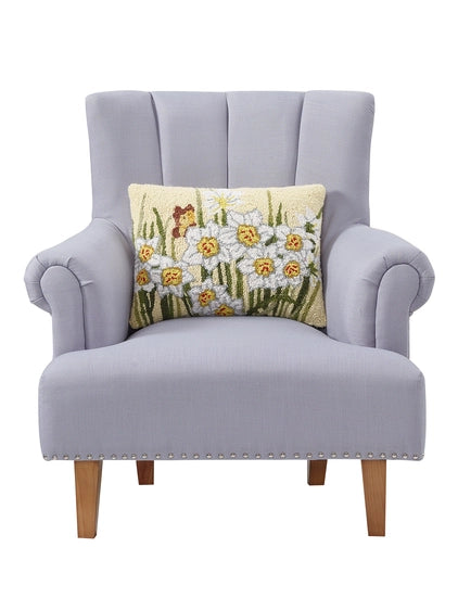 A woolen needle hook throw pillow featuring paperwhite blossoms