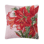 A woolen needle hook throw pillow in pink featuring large red amaryllis blossoms and foliage.