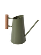 An olive green metal watering can with a long spout and a light brown wooden handle grip, shown against a plain white background.