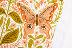An illustration of an orange butterfly with decorative patterns among green and peach leaves and flowers on a white background, featured on our Vintage Butterfly Flour Sack Tea Towel.