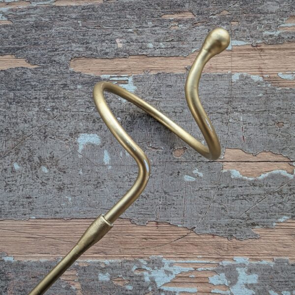 Closeup of matte gold Amaryllis support stake coil.